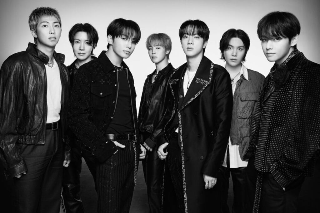 BTS all seven members standing together for their 2026 global comeback album.