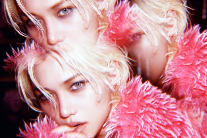 Close-up of Stray Kids Felix glowing glass skin and sharp jawline