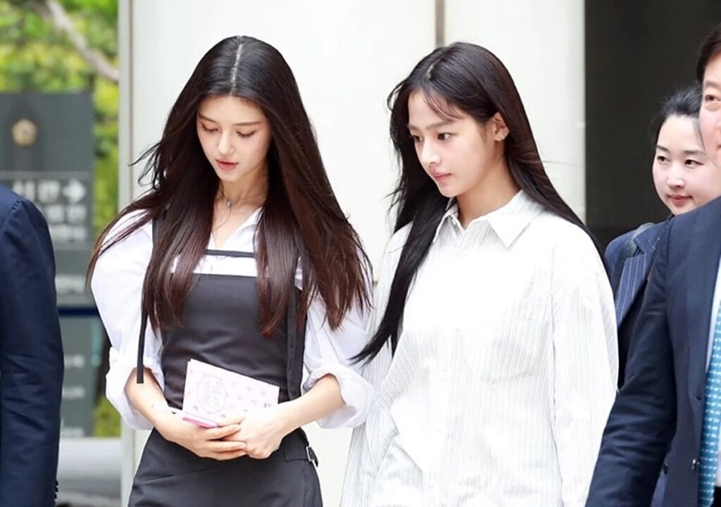 NewJeans members Danielle and Minji showcasing chic and modern street fashion styles in 2026.