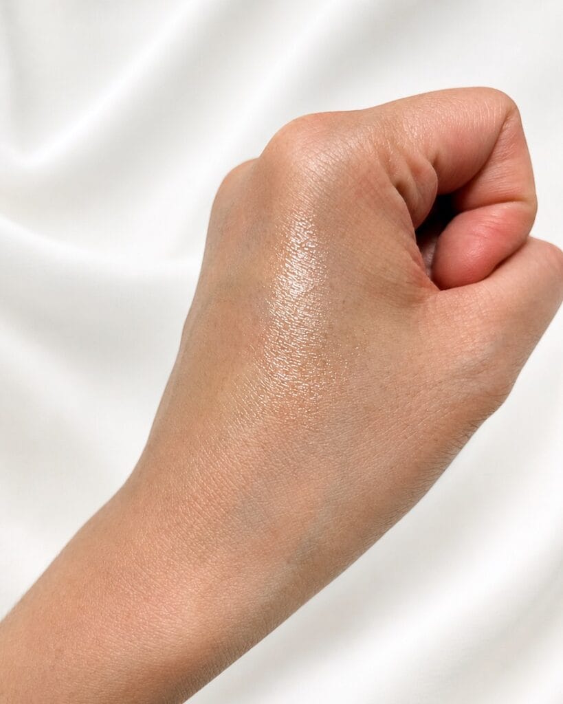 KAHI Multi Balm texture test on hand showing glossy moisturizing finish