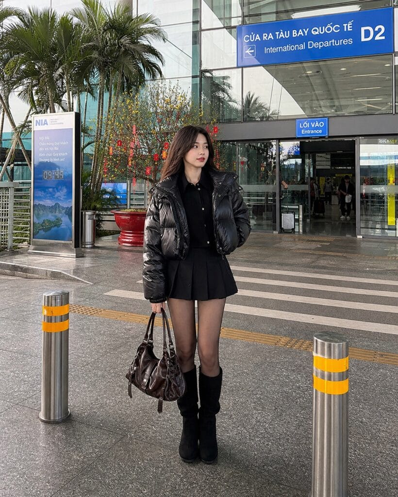 A trendy and youthful K-pop inspired look in Vietnam, recreating Karina's airport silhouette.