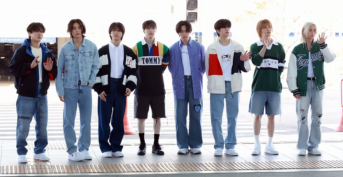 Stray Kids airport fashion at Incheon Airport in 2024 featuring denim, rugby shirts, varsity jackets, and casual streetwear.
